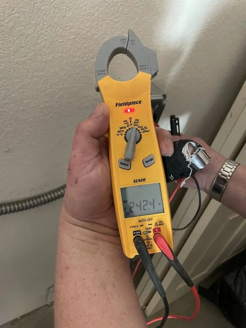 Voltage testing with clamp meter during Recessed Lighting Installation in Monticello